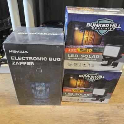 #8096 • (2) Bunker Hill Security LED-Solar Motion Light and Hemiua Electronic Bug Zapper
