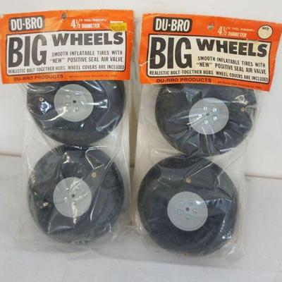 1239	VINTAGE MODEL AIRPLANE DU-BRO 4 1/2 IN 2 PAIRS OF BIG WHEELS
