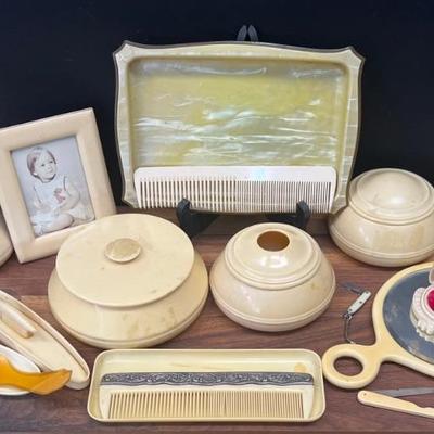 Vintage Bakelite And Mother Of Pearl Dresser Lot - Mirror, Tray, Combs, Lidded Powders, File, And More