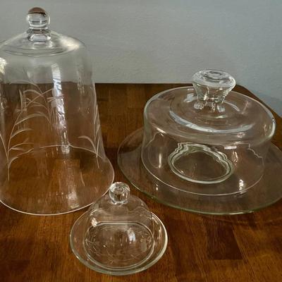 Clear Glass Cake Plate With Cover, Etched Floral Cloche, And An Etched Cloche With Tray