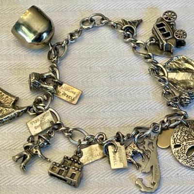 Sterling Silver Charm Bracelet With Assorted Charms - Crested Butte, Bell, Pixie Land, And More - 40 Grams 