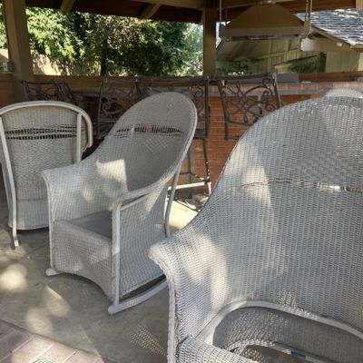 Beautiful wicker, rocking chairs that needs their seats. Replaced on some.