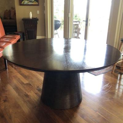 Mid Century Style Round Dining Table Made in Indonesia. Nice Heavy Wood Table with Conical Base wrapped with Round Reeds. Table  is 60in...