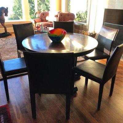  Round Metal Pedestal Table. Six Leather Chairs by Marie Yee(SOLD). Art Glass Bowl (SOLD). All Sold Separately