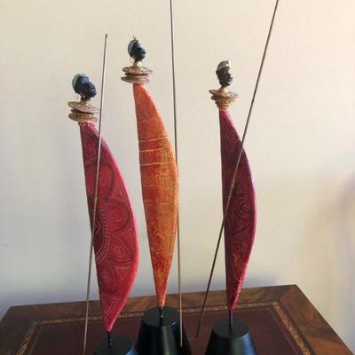 3 Wooden Figures representing the African Masai Warriors  H 21.1/2 in, 19.1/2 in and 19in.