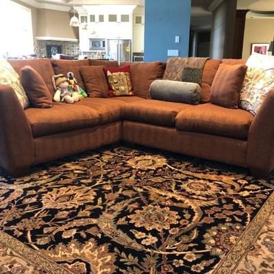 2 Part Sectional in a copper-tone herringbone style upholstery.-