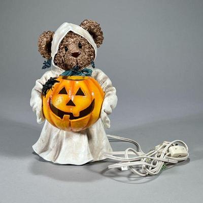 Halloween Bear | Adorable illuminated decoration designed as a bear in a ghost costume holding a jack-o’-lantern. - l. 5 x w. 6 x h. 9 in

