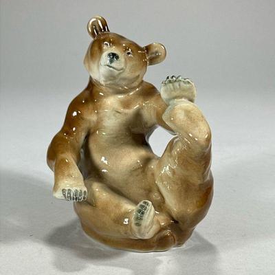 German Porcelain Bear | Playful seated bear with German makers mark on bottom. - l. 5.5 x h. 5.75 in

