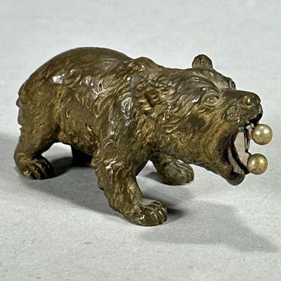 BRASS BEAR CIGAR CUTTER | Brass bear figurine storing small cigar cutter in mouth. - l. 3 x w. 1.25 x h. 1.5 in

