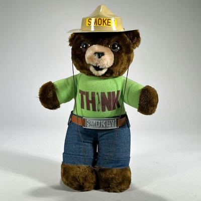 Smokey The bear Plush | Stuffed Smokey the Bear plush figure by R. Dakin, wearing a green “THINK” shirt and with SMOKEY hat. - l. 9 x h....