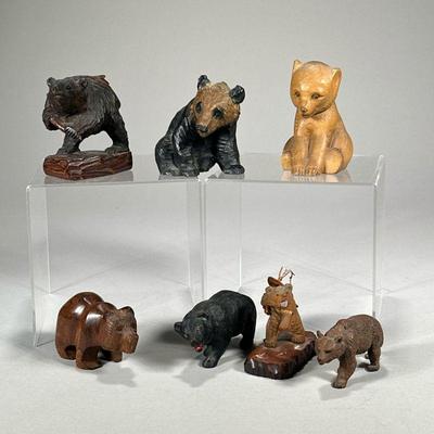(7pc) Carved Wood Bears | Carved bear figures in dark woods and other materials (a black bear and brown bear in composition), including...