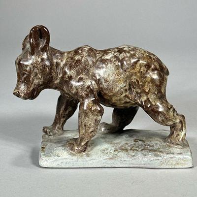 CERAMIC BEAR CUB | Mid-century glazed ceramic bear cub on a rectangular base. - l. 7.75 x w. 3.5 x h. 5.75 in

