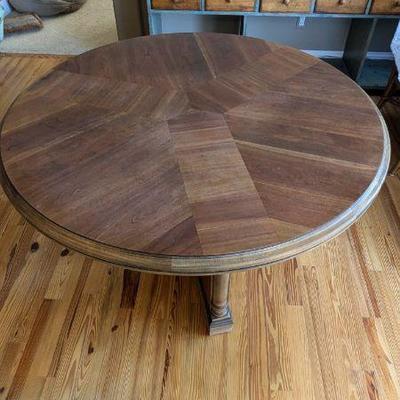 Lot #60 - Wooden Round Dining Table with Decorative Legs - Quality Craftsmanship