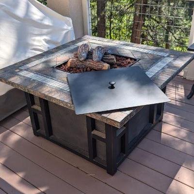 Lot #75 - Outdoor Fire Pit Table with Decorative Logs and Propane Tank Storage

