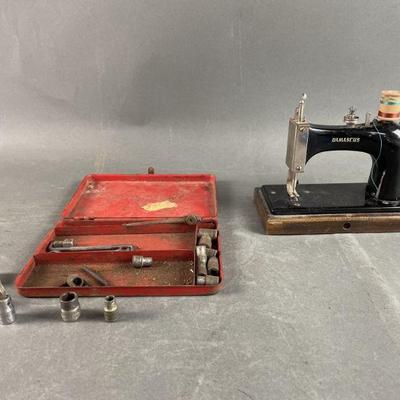 Lot 87 | Vintage Damascus Sewing Machine and More
