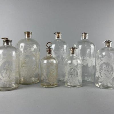 Lot 103 | Vtg Glass Floral Leaf Apothecary Bottles
