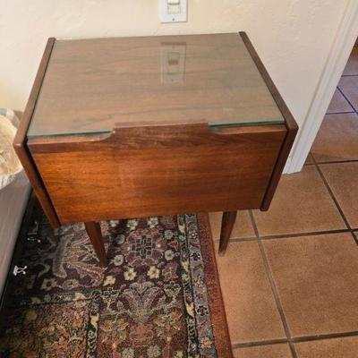 Includes protective glass top panel