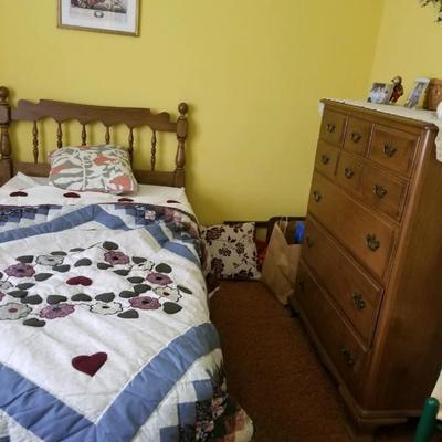 Twin bed, quilt, and dresser