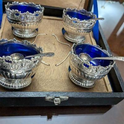 antique sterling plated with blue 
salt dinner table 
servers with spoons