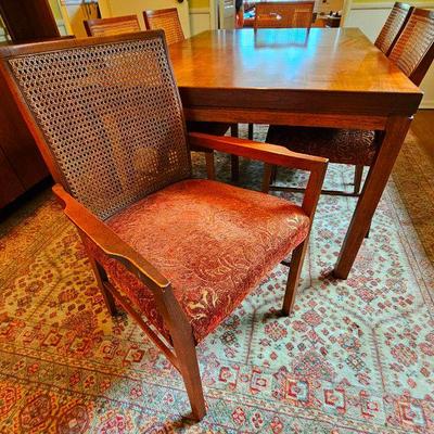 Danish Modern dining table, 6 cane back chairs & 2 leaves. Very good condition.