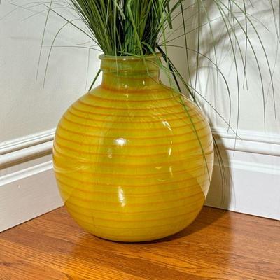 Art Glass Vase | Of large size, with yellow and orange striped pattern, with faux grass. - h. 14.25 x dia. 11 in

