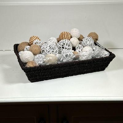 Decorative Basket | A dark wicker basket with woven decorative balls. - l. 16.25 in (basket)


