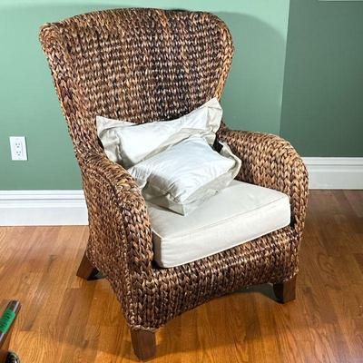 Wicker Wingback Chair | Wicker high back armchair with a beige seat cushion. - l. 29 x w. 29 x h. 41 in

