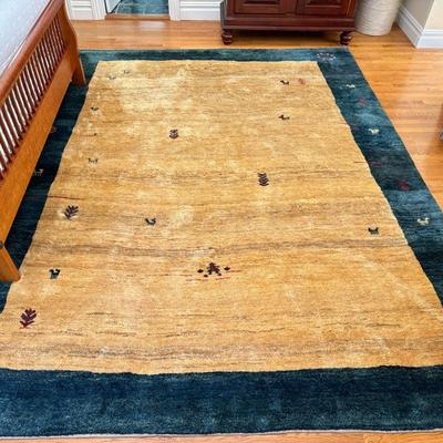 Wool Persian Gabbeh Carpet | Roomsize carpet of high wool pile, having a yellow beige field within a blue border - w. 9 x l. 11.5 ft

