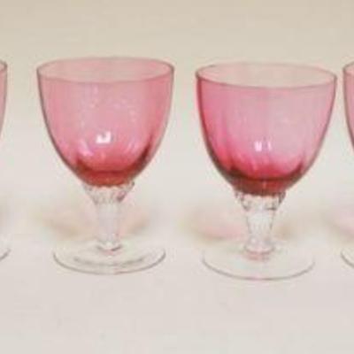 1056	8 CRANBERRY TO CLEAR GOBLETS, APPROXIMATELY 4 1/2 IN HIGH
