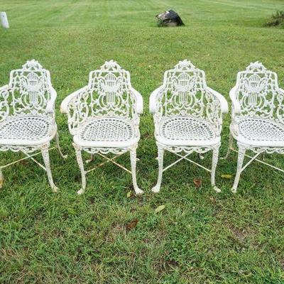 1256	SET OF 4 ORNATE CAST METAL GARDEN PATIO ARM CHAIRS, APPROXIMATELY 21 IN X 21 IN X 32 IN H
