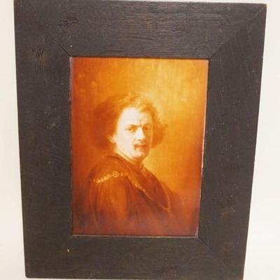 1002	PORCELAIN PLAQUE W/IMAGE OF REMBRANDT IN OAK FRAME APPROXIMATELY 14 IN X 17 IN OVERALL
