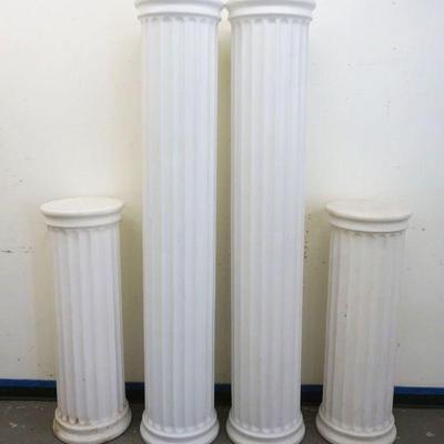 1260	GROUP OF 4 PLASTIC FLUTED ARCHITECTUAL COLLUMNS, TALLEST APPROXIMATELY 72 IN HIGH
