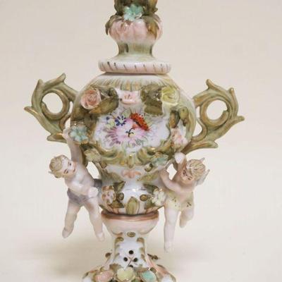 1050	MINIATURE MEISSEN PORCELAIN BOLTED URN, DOUBLE HANDLED W/CHERUBS & FLOWERS, APPROXIMATELY 7 IN HIGH
