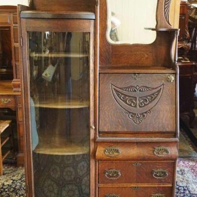 1247	ANTIQUE OAK SIDE BY SIDE WITH CARVED GALLERY AND MIRRORED BACK, APPROXIMATELY 39 IN X 14 IN X 75 IN H
