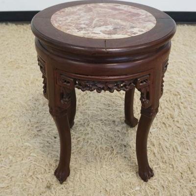 1242	ROUND ASIAN STAND WITH BROWN MARBLE INSET TOP, PIERCED CARED SKIRT, APPROXIMATELY 16 IN X 20 IN H
