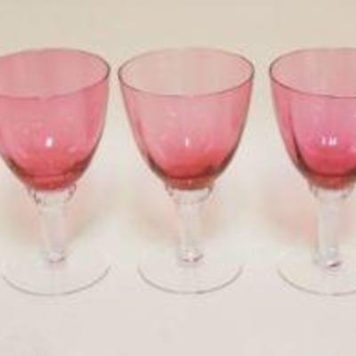 1057	9 CRANBERRY TO CLEAR GOBLETS, APPROXIMATELY 6 1/4 IN HIGH
