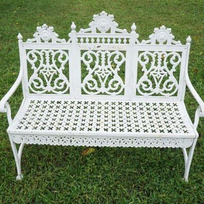 1253	ORNATE CAST METAL GARDEN PATIO BENCH SETTEE, APPROXIMATELY 34 IN X181 IN X 39 IN H
