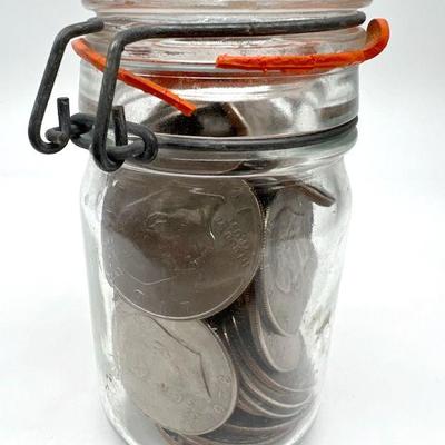 Eisenhower Dollar Coins in an Old Mason Jar

