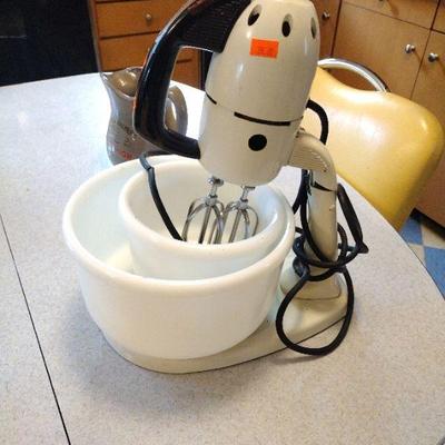 old mixer with milk glass mixing bowls