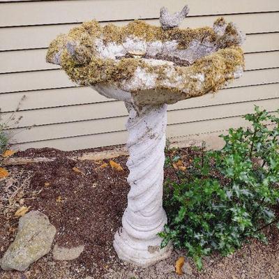 Weathered concrete bird bath