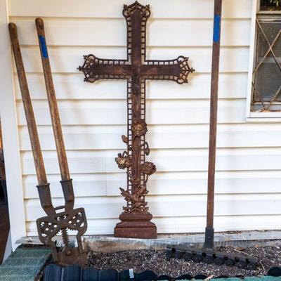 Antique cast iron cross, antique lawnmower and horn sheers