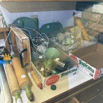 Green kitchen utensils by the pile