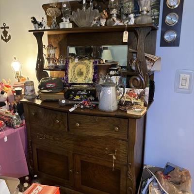There’s a great piece of furniture behind all these items