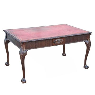 CHIPPENDALE CARVED LEATHER TOP BUREAU PLAT | An impressive carved desk with an inset red leather top with gilt tooling above 2 reeded...