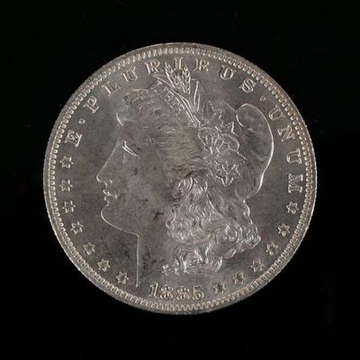 1885-O MORGAN SILVER DOLLAR | Enclosed in an envelope describing it as "borderline MS 65"

