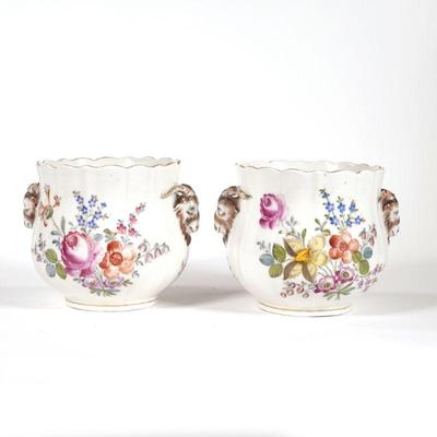 RAMSHEAD-MOUNTED PORCELAIN CACHE POTS | Hand painted with flowers and with Ramshead mounts, with indistinct blue underglaze mark on...