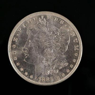 1885-P MORGAN SILVER DOLLAR | Enclosed with a piece of paper describing it as "borderline MS65"

