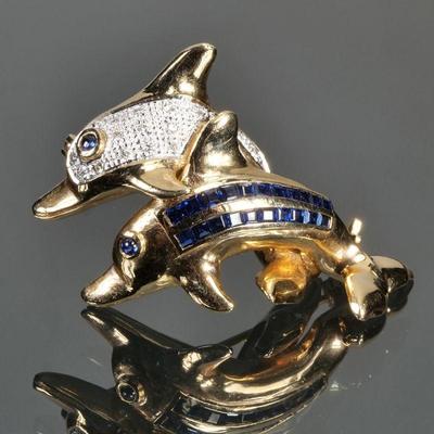 SAPPHIRE, DIAMOND, & 14K GOLD DOLPHIN PIN | Designed as two dolphins, one diamond-encrusted, the other having two rows of square cut...