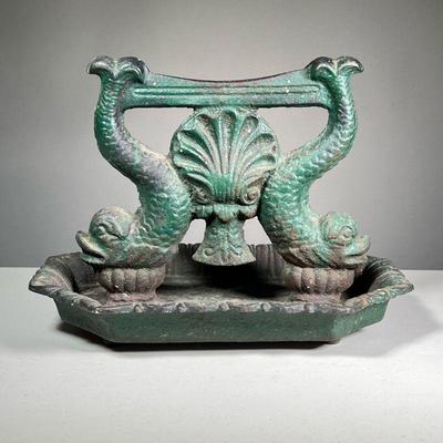 19TH C. DOLPHIN FORM CAST IRON BOOT SCRAPE | An early boot scraper decorated with dolphins (fish) and a central seashell and with old...