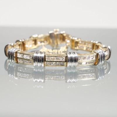 DIAMOND & 14K GOLD LINK BRACELET | Designed as links of (tested to) 14k yellow gold mounting double-lines of channel-set diamonds...